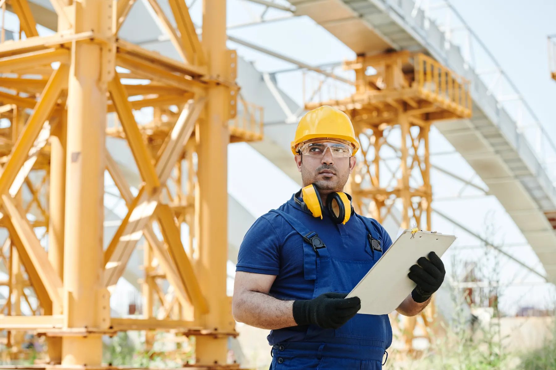 Safety specialist carrying out an inspection at an industrial construction site