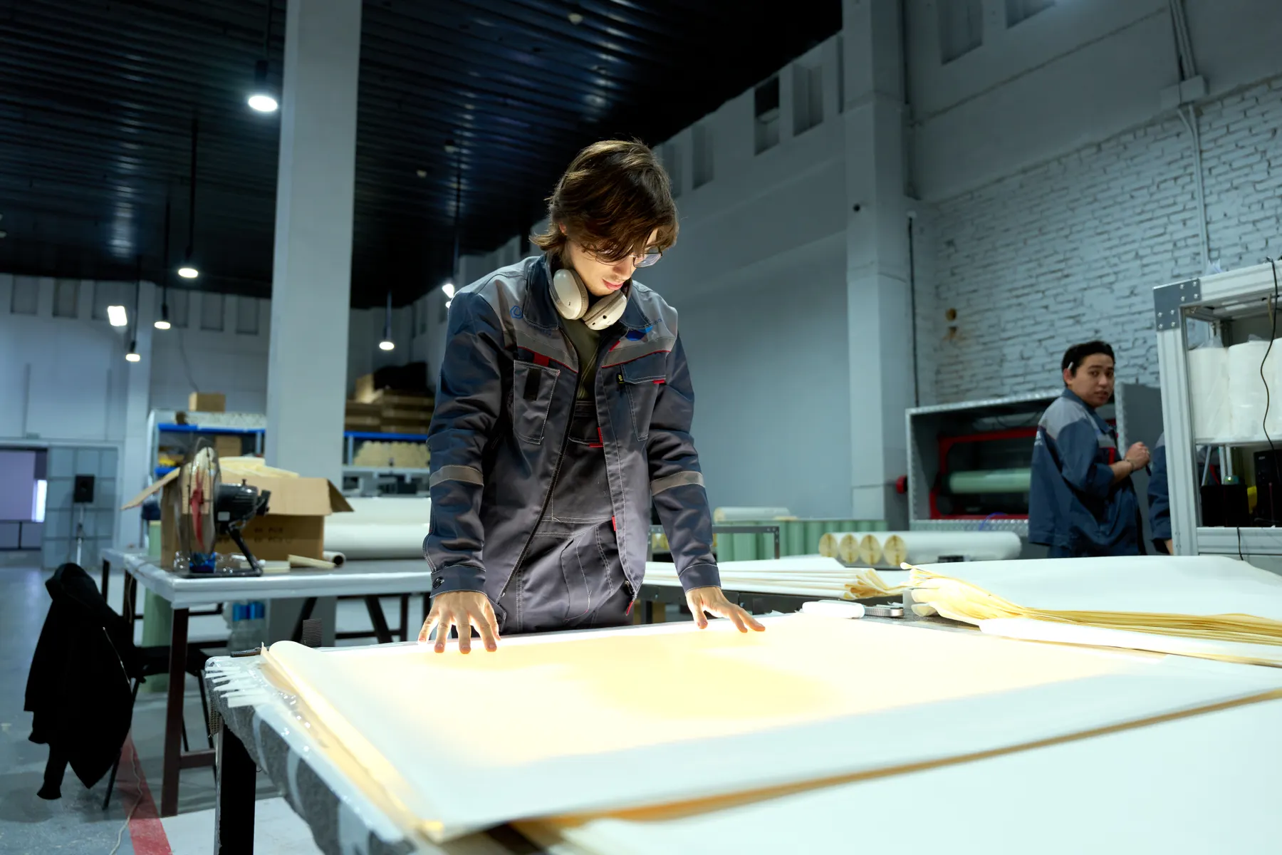Quality specialist inspecting materials in an export manufacturing environment